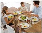 The family are eating dinner together